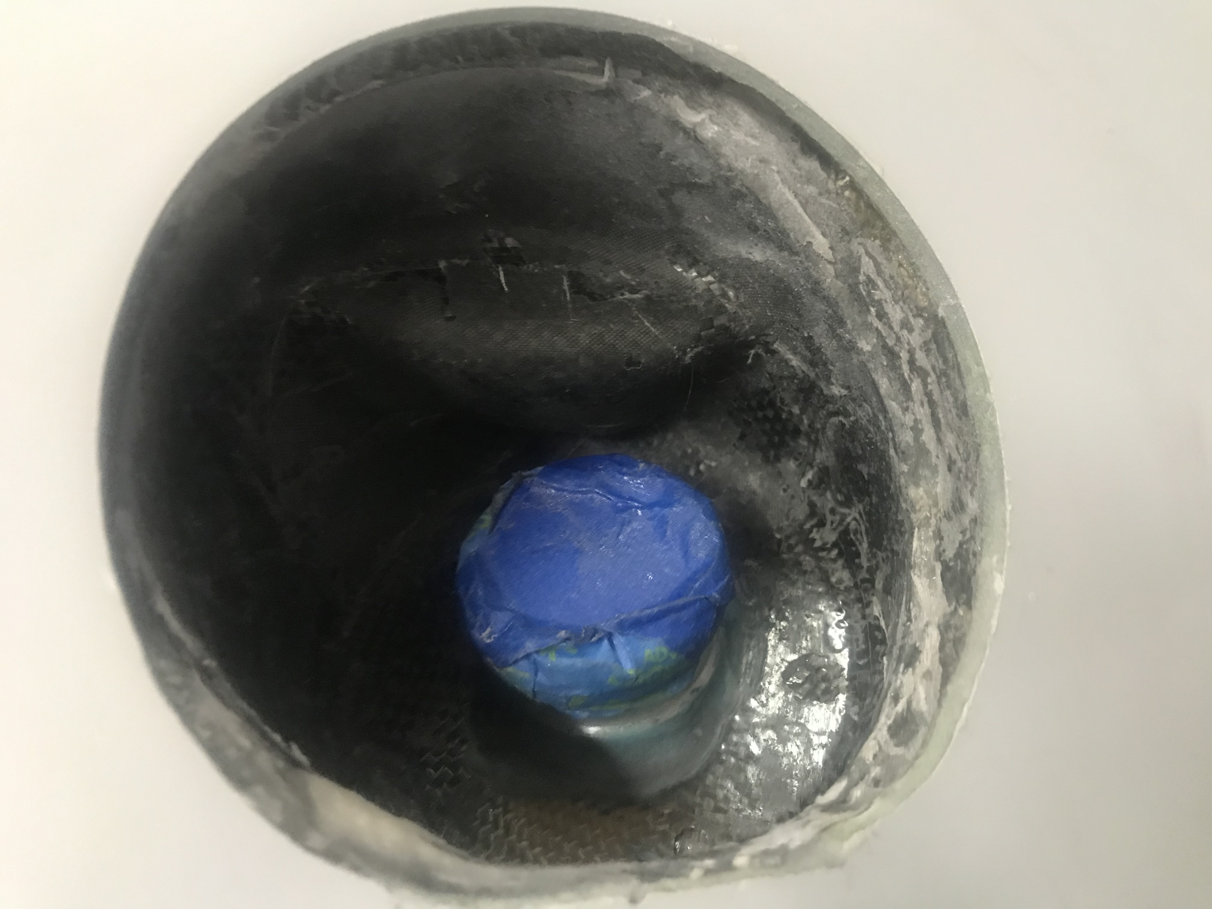 Actual cap covered with blue tape.  This is the bucket built for the filler neck and cap, with a recess for the rudder bell crank to swing without hitting the bucket.
