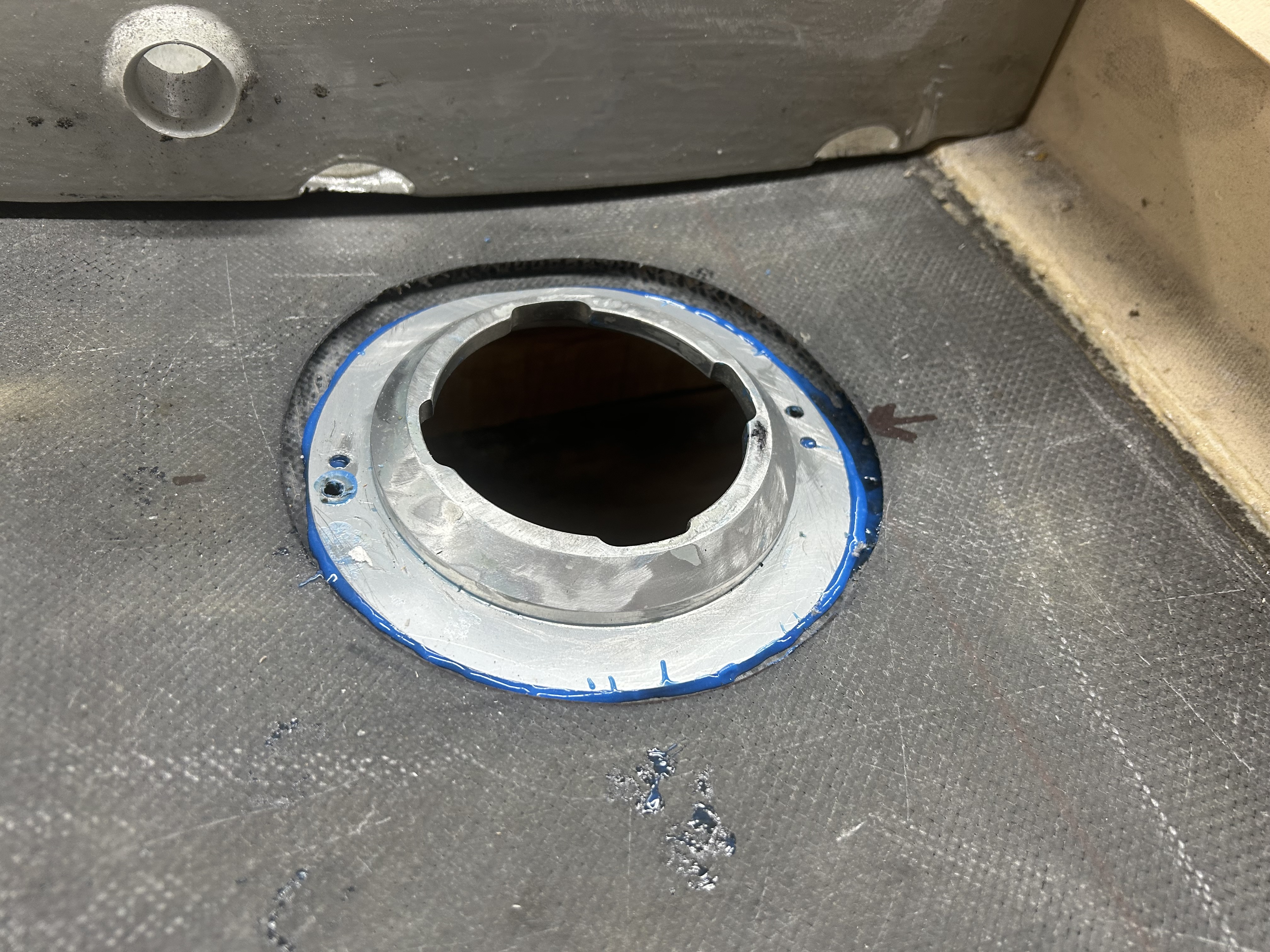 Fuel cap retainer ring Hysol bonded in place